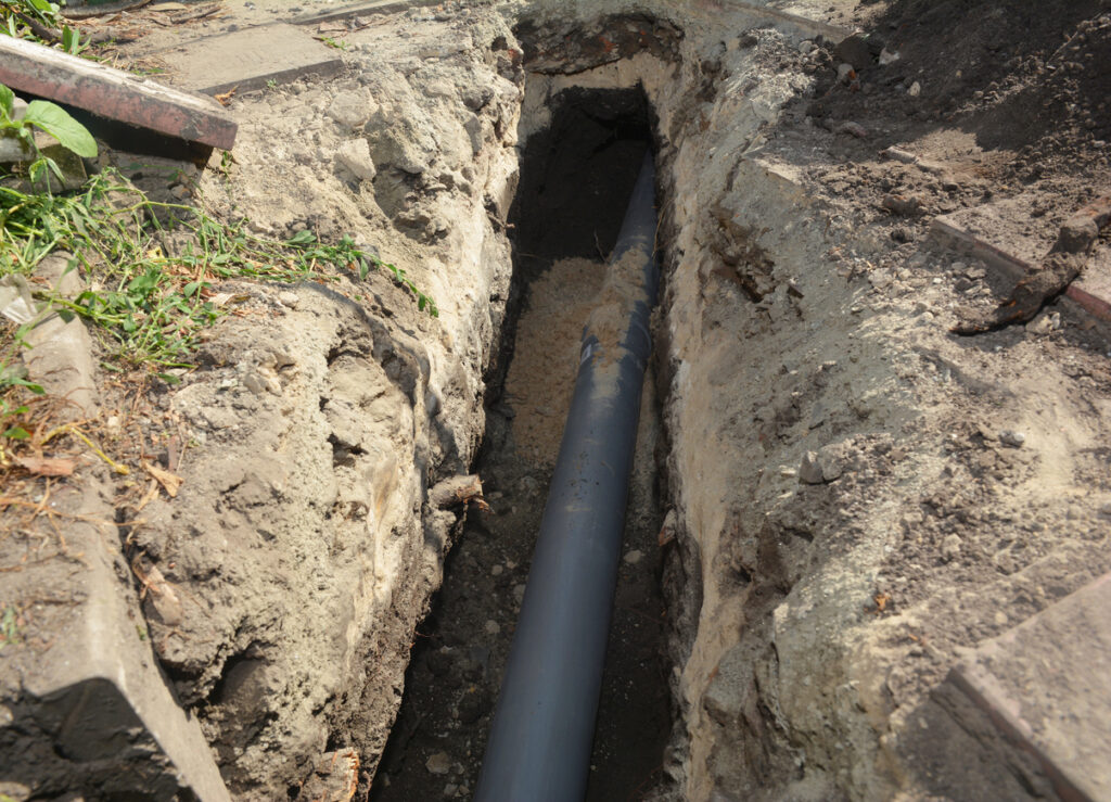 Sewer pipe in the ground trench
